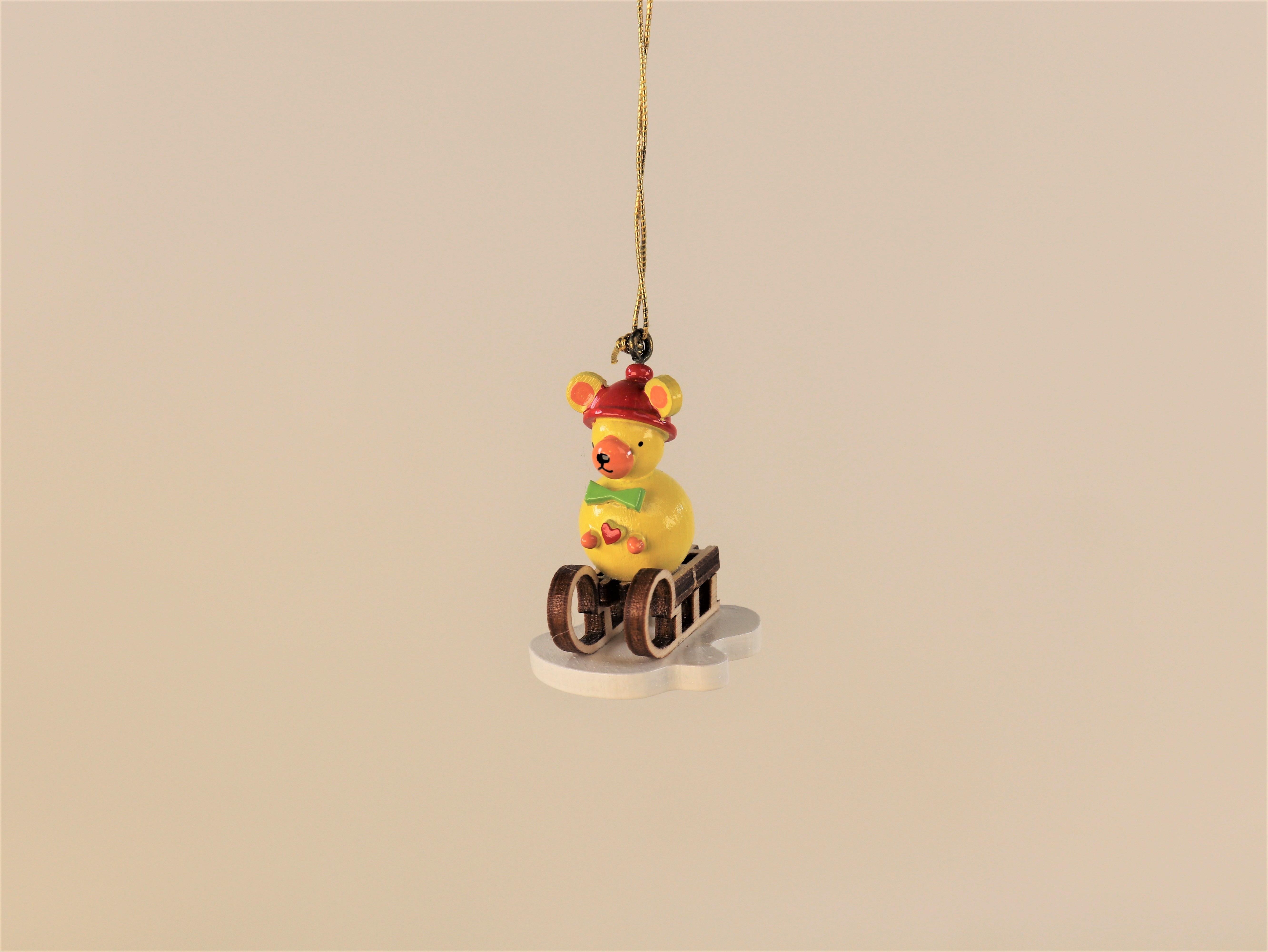 Winter- / Weihnachts-Baumschmuck Teddy gelb auf Schlitten